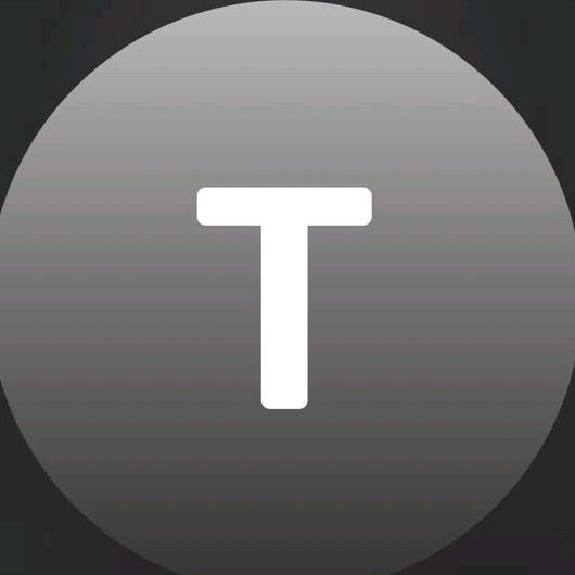 T.