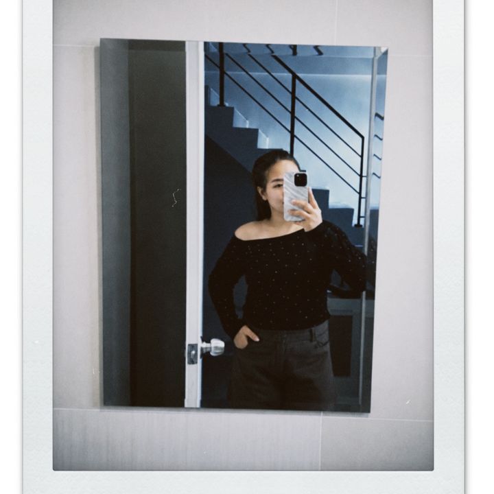T.
